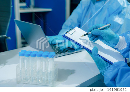 Microbiologists and nutrition experts analyze molecular samples in advanced food science labs. 141961982