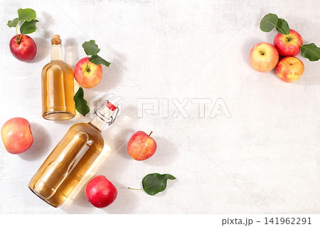 Apple cider with fruit in baskets, Thanksgiving decorations and country harvest, healthy natural food and home canning concept, longterm storage at home, banner for a screen, business card for a cafe Apple cider with fruit in baskets, Thanksgiving decorations and country harvest, healthy natural food and home canning concept, longterm storage at home, banner for a screen, business card for a cafe 141962291