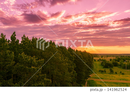 Rural landscape at sunset. Countryside in the evening. Aerial view Rural landscape at sunset. Countryside in the evening. Aerial view 141962524