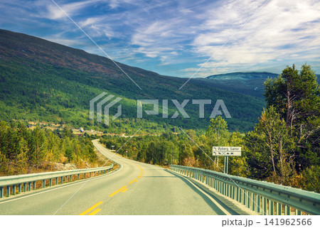 Driving along a mountain road in Norway Driving along a mountain road in Norway 141962566