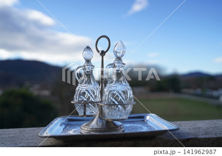 Crystal Decanters on Silver Tray in Outdoor Setting Crystal Decanters on Silver Tray in Outdoor Setting 141962987
