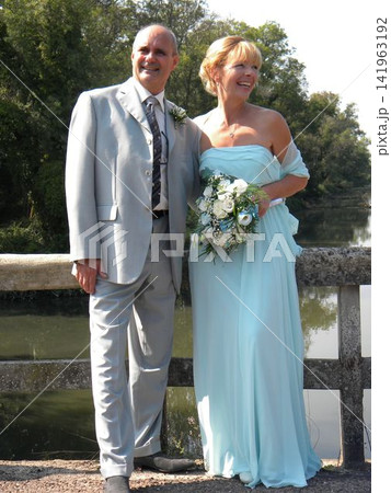 Mature Couple Joyfully Poses on Their Wedding Day Mature Couple Joyfully Poses on Their Wedding Day 141963192