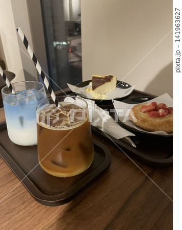 Cafe desserts featuring cakes, coffee, latte, and trendy drinks arranged beautifully. A cozy, modern selection that highlights sweetness, warmth, and a relaxed cafe lifestyle atmosphere. Cafe desserts featuring cakes, coffee, latte, and trendy drinks arranged beautifully. A cozy, modern selection that highlights sweetness, warmth, and a relaxed cafe lifestyle atmosphere. 141963627