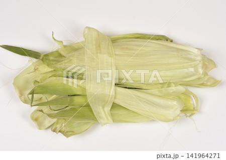Green corn husks bundle on white background 141964271