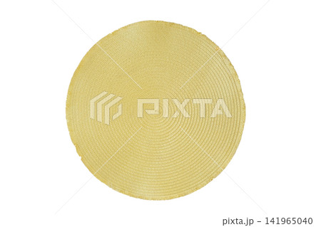 Kitchen plate stand for serving. Woven decorative napkin made of artificial straw isolated on a white background. Round decorative coaster in light green color. Top view. Kitchen plate stand for serving. Woven decorative napkin made of artificial straw isolated on a white background. Round decorative coaster in light green color. Top view. 141965040