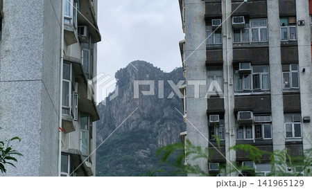 Hong Kong July 19 2026 Lion Rock framed by apartment buildings. 141965129