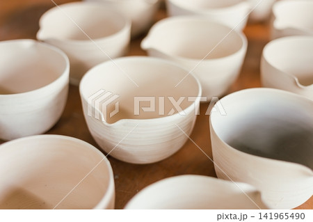 The process of creating pottery. The process of creating pottery. 141965490