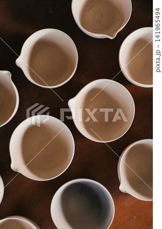 The process of creating pottery. 141965494