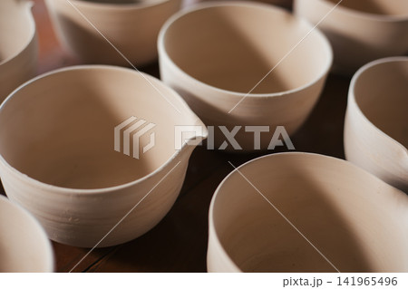The process of creating pottery. The process of creating pottery. 141965496