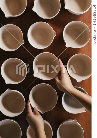 The process of creating pottery. The process of creating pottery. 141965514