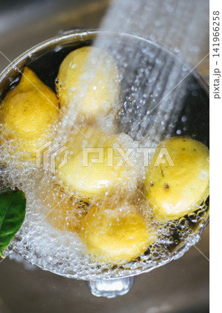 Washing fresh lemons Washing fresh lemons 141966258