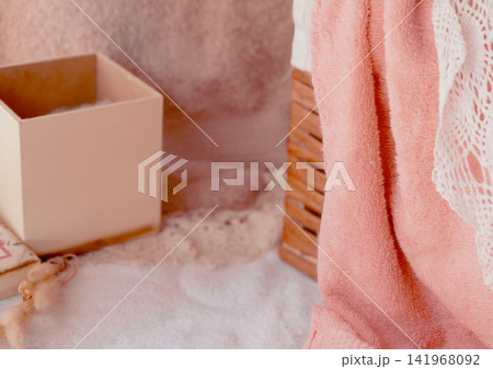 Pink towel, white lace, and pastel box creating a cozy, soft atmosphere, embracing wellness, beauty, and peaceful self-care with calming textures Pink towel, white lace, and pastel box creating a cozy, soft atmosphere, embracing wellness, beauty, and peaceful self-care with calming textures 141968092