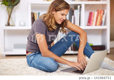 Research, streaming or girl on laptop in home to relax with internet connection for film, video or movie online. Smile, blog and happy woman on social media and technology for subscription in house Research, streaming or girl on laptop in home to relax with internet connection for film, video or movie online. Smile, blog and happy woman on social media and technology for subscription in house 141968751