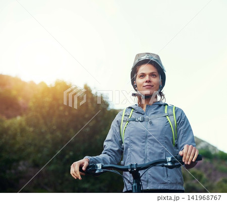 Morning, woman and mountain bike in outdoors, fitness and cycling sports for cardio adventure. Female person, athlete and bicycle for exercise in nature, workout and training on sky mockup space Morning, woman and mountain bike in outdoors, fitness and cycling sports for cardio adventure. Female person, athlete and bicycle for exercise in nature, workout and training on sky mockup space 141968767