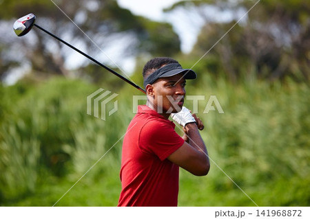 Black man, golf course and swing with club for point, score or par in outdoor nature. African male person, sports player or golfer hitting ball for competition, challenge or practice on grass field Black man, golf course and swing with club for point, score or par in outdoor nature. African male person, sports player or golfer hitting ball for competition, challenge or practice on grass field 141968872