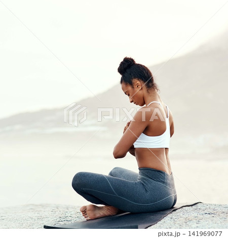 Fitness, meditation and yoga with woman on beach for mental health, peace or wellness in morning. Exercise, training and zen with sporty person on mat at coast by ocean or sea for balance and mindset Fitness, meditation and yoga with woman on beach for mental health, peace or wellness in morning. Exercise, training and zen with sporty person on mat at coast by ocean or sea for balance and mindset 141969077