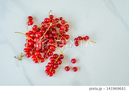 Fresh Red Currants on White Marble Background with Copy Space Top View Fresh Red Currants on White Marble Background with Copy Space Top View 141969681