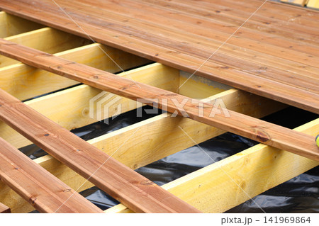 Unfinished wooden floor construction, half done construction surface Unfinished wooden floor construction, half done construction surface 141969864