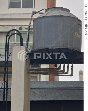 Buenos Aires, Argentina - April 21, 2026: Elevated Residential Water Storage Tank and Plumbing 141969919