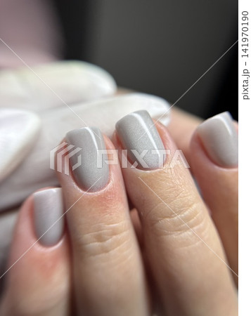 Perfectly done gel polish manicure in nude pearl shade, close-up of well-groomed fingers, professional nail training and hand care 141970190