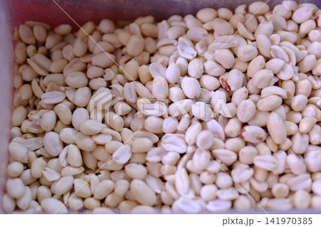 Shelled peanuts with smooth natural kernels arranged in close up for healthy snacks baking cooking and everyday plant based nutrition with clean simple presentation 141970385