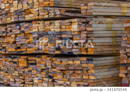 Stacked Lumber Wood Planks in Outdoor Storage Stacked Lumber Wood Planks in Outdoor Storage 141970549