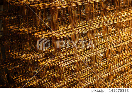 Close-up of Stacked Rusty Metal Mesh Panels Close-up of Stacked Rusty Metal Mesh Panels 141970558