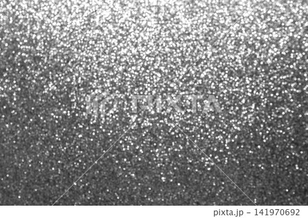 Silver glitter bokeh background with sparkling texture and metallic shine for festive designs 141970692