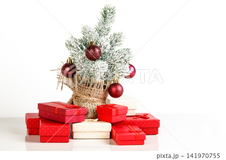 Christmas tree gift boxes with toys on a white background 141970755