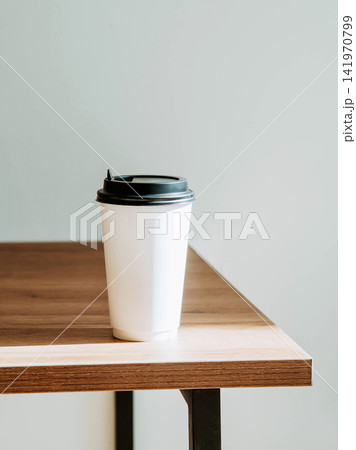 Takeaway Coffee Cup on Wooden Table Takeaway Coffee Cup on Wooden Table 141970799