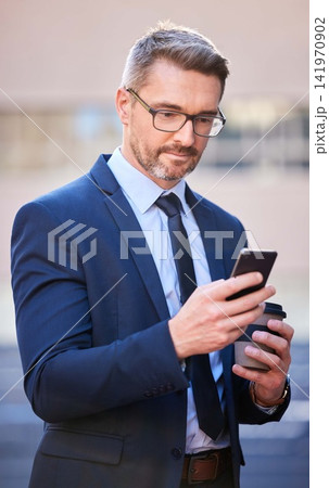 Smart, businessman and cellphone with coffee in city as property manager for company in Berlin. Male person, professional and technology for connection, communication and app in Germany in suit Smart, businessman and cellphone with coffee in city as property manager for company in Berlin. Male person, professional and technology for connection, communication and app in Germany in suit 141970902