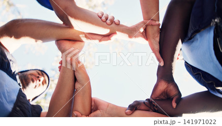 Nature, group and people holding arms for support, solidarity and trust in non profit organization. Bonding, low angle and circle of volunteers with hands together for connection in ngo at park Nature, group and people holding arms for support, solidarity and trust in non profit organization. Bonding, low angle and circle of volunteers with hands together for connection in ngo at park 141971022