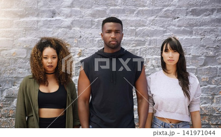 Friends, portrait and fashion with confidence on brick wall in outdoor for casual, style and elegant. Diversity, group and inclusion with clothes or street wear, outfit and satisfied together Friends, portrait and fashion with confidence on brick wall in outdoor for casual, style and elegant. Diversity, group and inclusion with clothes or street wear, outfit and satisfied together 141971044