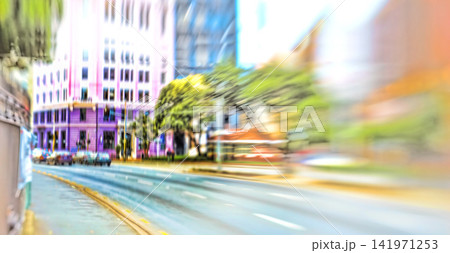 Street, city and blur of cars, traffic and urban buildings outdoor in New York cityscape. Motion, town and road with fast transport, architecture or infrastructure on landscape background in USA Street, city and blur of cars, traffic and urban buildings outdoor in New York cityscape. Motion, town and road with fast transport, architecture or infrastructure on landscape background in USA 141971253