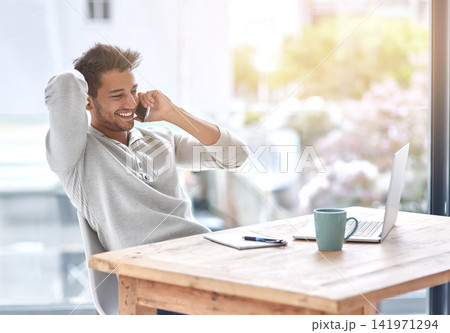 Business owner, phone call and desk for audio conversation, professional communication or telecom for online startup on laptop. Happy person, smile and cellular mobile in office for listen or discuss Business owner, phone call and desk for audio conversation, professional communication or telecom for online startup on laptop. Happy person, smile and cellular mobile in office for listen or discuss 141971294