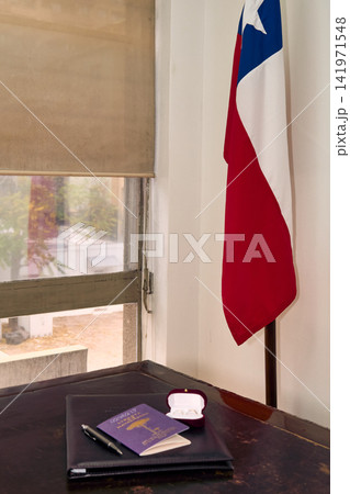 The couple's rings, along with the civil union documents, highlighting the Chilean flag, await the newlyweds on their wedding day. The couple's rings, along with the civil union documents, highlighting the Chilean flag, await the newlyweds on their wedding day. 141971548