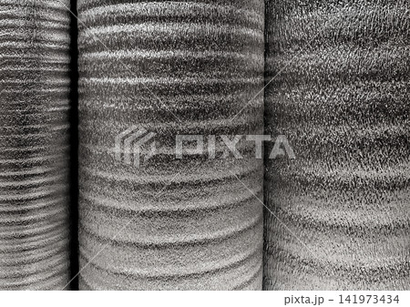 Silver rolls of insulation material, building materials in a hardware store 141973434