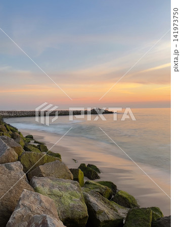 Sunset over Furadouro beach shore in Ovar Portugal Sunset over Furadouro beach shore in Ovar Portugal 141973750