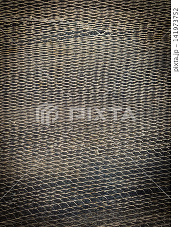 Detailed texture of traditional fishing net mesh Detailed texture of traditional fishing net mesh 141973752