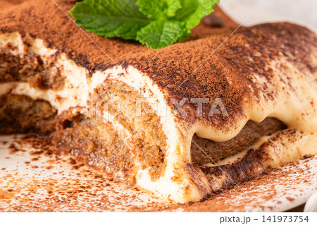 Delicious tiramisu dessert with cocoa powder top 141973754