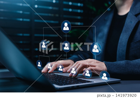 Organizational workforce management connects employees in digital hierarchy as professionals use laptops with team structure, leadership, human resources, talent coordination, business collaboration Organizational workforce management connects employees in digital hierarchy as professionals use laptops with team structure, leadership, human resources, talent coordination, business collaboration 141973920