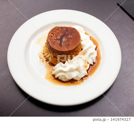 Sweet european dessert flan with whipped cream Sweet european dessert flan with whipped cream 141974327