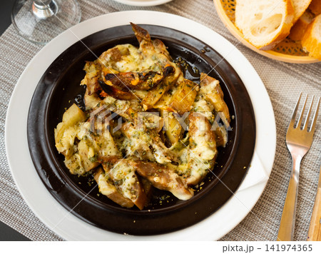 Baked eggplant gratin with cheese and herbs 141974365