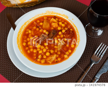 Tripe with chorizo and chickpeas served in bowl Tripe with chorizo and chickpeas served in bowl 141974378