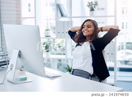 Happy woman, relax and break with computer for rest, done or completion of tasks or work at office. Female person or employee with smile in comfort for finished, submission or relief at workplace Happy woman, relax and break with computer for rest, done or completion of tasks or work at office. Female person or employee with smile in comfort for finished, submission or relief at workplace 141974650