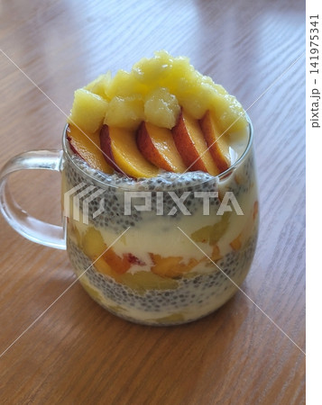 Creamy chia pudding topped with juicy plum slices, offering a smooth texture and naturally sweet, fruity contrast. Fresh, wholesome, and visually calming, perfect for healthy breakfast or dessert 141975341