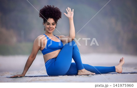 Portrait, yoga and happy woman at beach for exercise, fitness and healthy body outdoor in Brazil. Smile, girl and practice pilates in nature for wellness, balance or stretching to relax in summer Portrait, yoga and happy woman at beach for exercise, fitness and healthy body outdoor in Brazil. Smile, girl and practice pilates in nature for wellness, balance or stretching to relax in summer 141975960