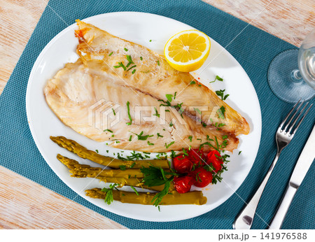 Perch fillet with lemon and asparagus Perch fillet with lemon and asparagus 141976588