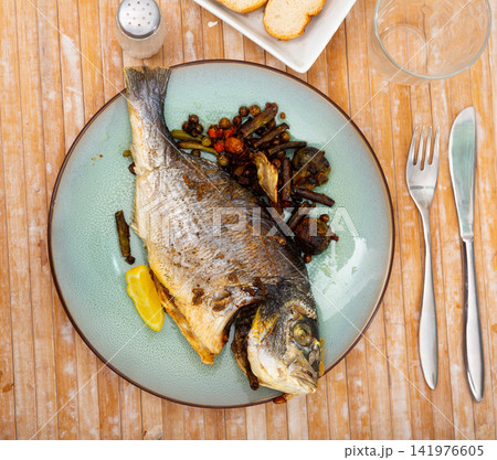Grilled dorada with roasted Brussels sprouts, green beans, peas, chickpeas Grilled dorada with roasted Brussels sprouts, green beans, peas, chickpeas 141976605