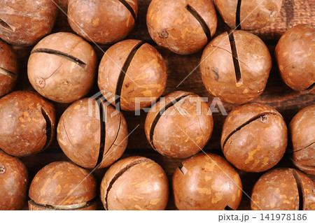 Wooden balls sit on a wooden surface Wooden balls sit on a wooden surface 141978186